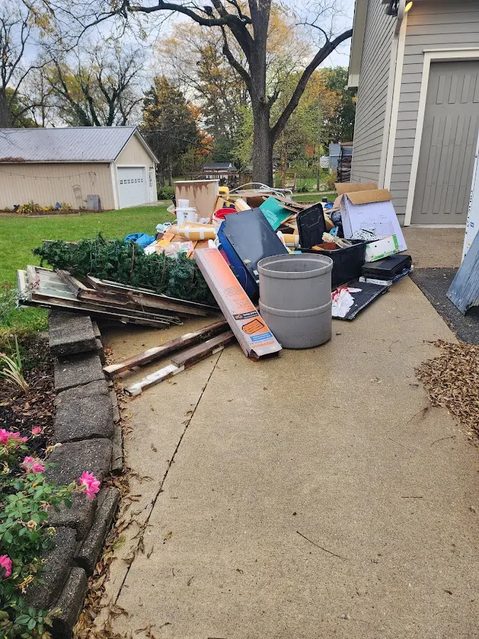 Dumpster being loaded with debris for Commercial Dumpster Rental in Burkburnett